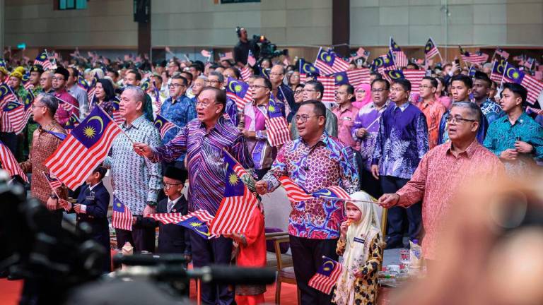 Anwar with (from left) Communications Minister Datuk Fahmi Fadzil, Deputy Prime Minister Datuk Seri Fadillah Yusof and Selangor Menteri Besar Datuk Seri Amirudin Shari at the event yesterday. – BERNAMA