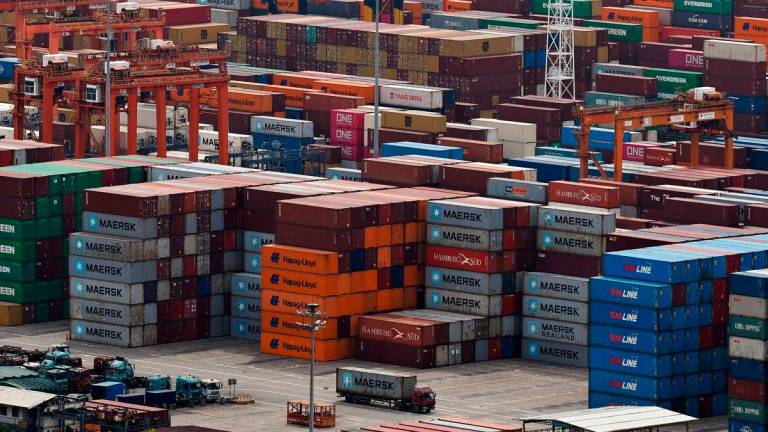 A truck carrying a container moves at the Yantian port in Shenzhen, Guangdong province, China April 17, 2025. REUTERSpix