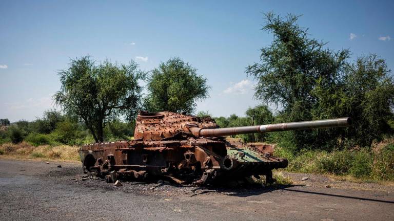 The charred remaining of a T-72 tank lay on the road that connects Shiraro to Shire on October 12, 2024. The two-year war in Ethiopia's Tigray region left hundreds of thousands people dead, more than one million still displaced and cost more than $20 billion in damage, until a peace deal in November 2022 ended the bloodshed.The war erupted in November 2020 when Prime Minister Abiy Ahmed sent the army to overthrow the leaders of the northern Tigray region, accusing their forces of attacking federal military bases. - Michele Spatari / AFP