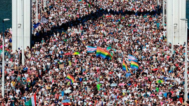 People cross Elisabeth Bridge during the Budapest Pride March in Budapest, Hungary, June 28, 2025. REUTERS/Bernadett Szabo