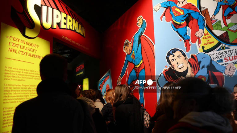People visit the exhibition titled “Superman, the hero with a thousand and one lives” during the 52nd Angouleme International Comics Festival in Angouleme, on January 30, 2025. - AFP