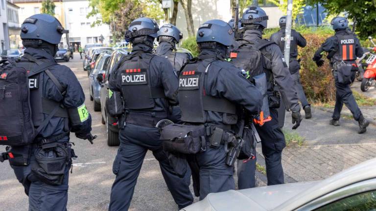 Policemen are seen on September 5, 2025 outside a vocational college in Essen, western Germany, where a teacher has been injured in a stabbing, according to police. Germany OUT