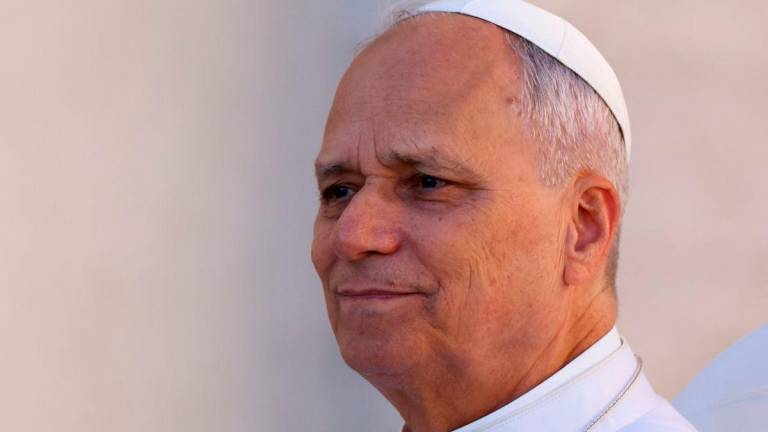 Pope Leo XIV look on on the day he holds an audience for the Jubilee of Migrants at the Vatican, October 4, 2025. REUTERS/Ciro De Luca