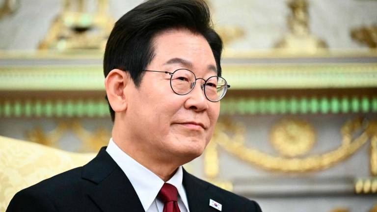 South Korean President Lee Jae Myung looks on during a bilateral meeting with US President Donald Trump in the Oval Office of the White House in Washington, DC, on August 25, 2025. AFPPix