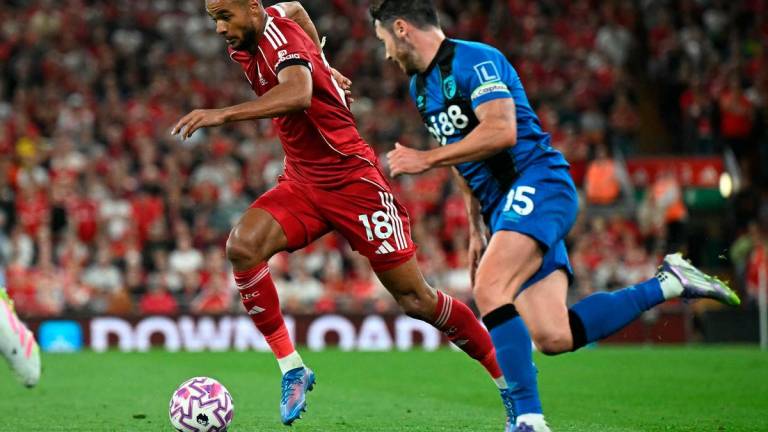 Liverpool’s Dutch striker #18 Cody Gakpo (L) vies with Bournemouth’s English defender #15 Adam Smith (R) during the English Premier League football match between Liverpool and Bournemouth. AFPPix