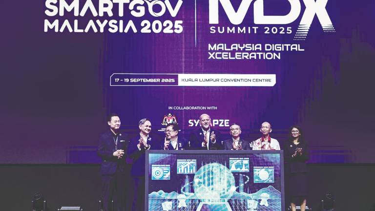 Gobind (fourth,left) officiates the launch of the SmartGov Malaysia Summit 2025 and the Malaysia Digital Xceleration Summit 2025 at the Kuala Lumpur Convention Centre today. – Bernamapic