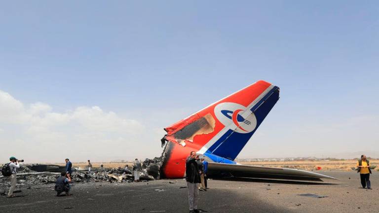 Journalists inspect a destroyed plane on the tarmac at the Sanaa International Airport on May 7, 2025. AFPpix