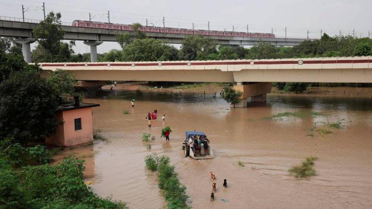 People wade through a flooded road after a rise in the water level of river Yamuna due to heavy monsoon rains, in New Delhi, India, September 3, 2025. - REUTERSPIX