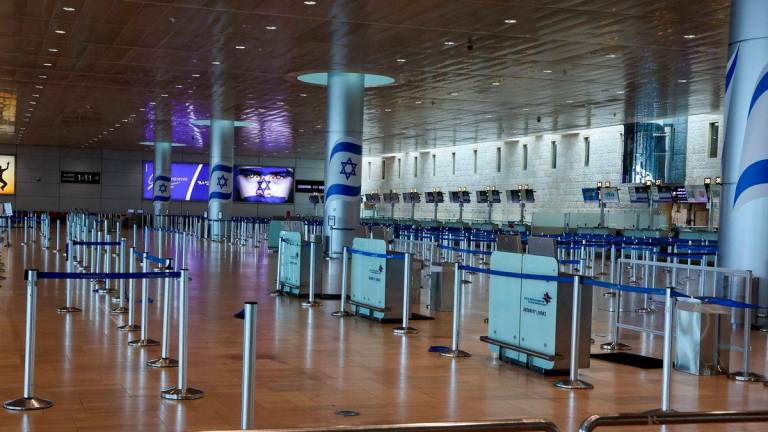 This picture shows the empty departures hall at Ben Gurion Airport near Tel Aviv on June 13, 2025 after Israel closed its air space to takeoff and landing. Israel pounded Iran in a series of air raids on June 13 - AFPPIX