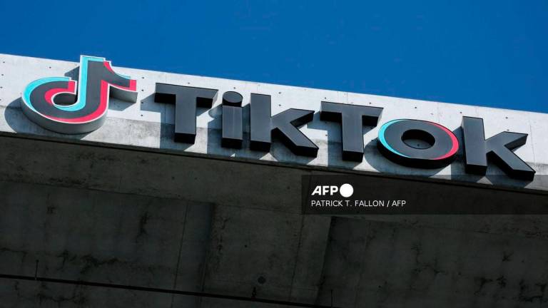 The TikTok logo is displayed on signage outside TikTok social media app company offices in Culver City, California on September 30, 2025. - AFP
