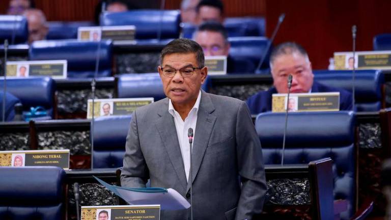 Menteri Dalam Negeri Datuk Seri Saifuddin Nasution Ismail pada Persidangan Dewan Rakyat sempena Mesyuarat Ketiga Penggal Ketiga Parlimen ke-15 di Parlimen hari ini. - fotoBERNAMA