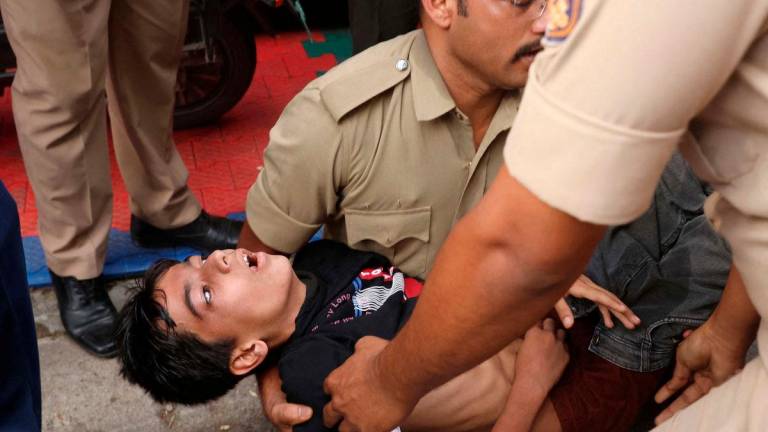A boy lies unconscious following a stampede outside a cricket stadium in Bengaluru, India, June 4, 2025. REUTERS.