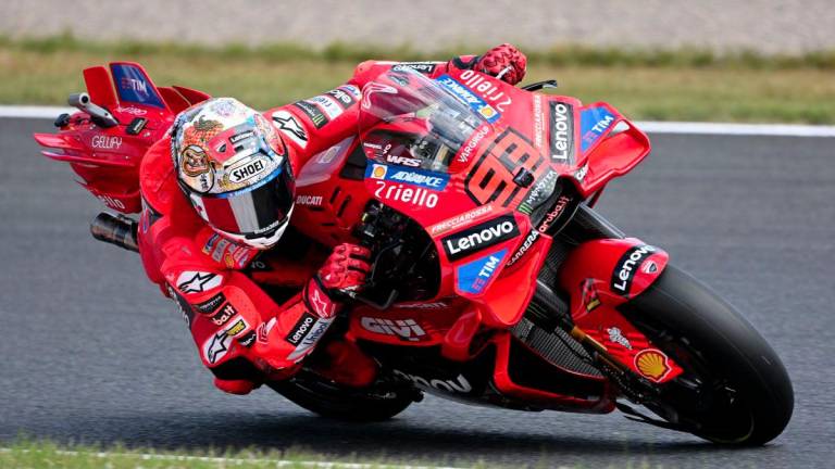 Ducati Lenovo Team rider Marc Marquez of Spain drives his motorcycle during the MotoGP class practice session of the MotoGP Japanese Grand Prix at the Mobility Resort Motegi in Motegi, Tochigi prefecture on September 26, 2025. - AFPPIX
