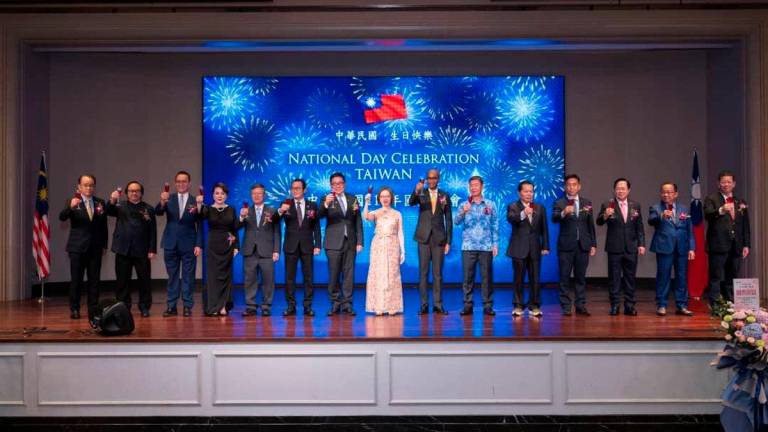 Taipei Economic and Cultural Office representative (head of mission) in Malaysia, H.E. Phoebe Yeh (middle) with special guests on stage during the national day reception,