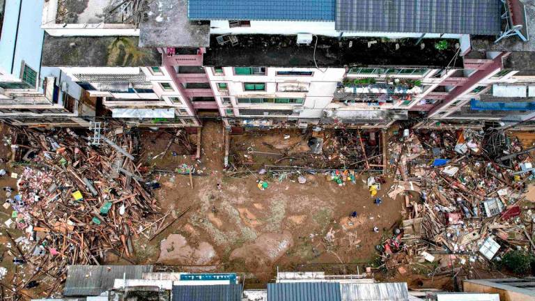 An aerial view of damaged buildings and debris in the aftermath of flooding in Congjiang, in southwestern China’s Guizhou province on June 25, 2025. (Photo by AFP)