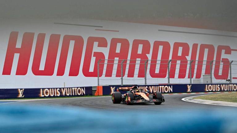 McLaren's Australian driver Oscar Piastri competes during the qualifying session of the Formula One Hungarian Grand Prix at the Hungaroring circuit in Mogyorod, near Budapest, Hungary, on August 2, 2025. - AFPPIX