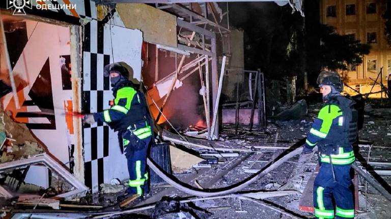This handout photograph taken and released by the Ukrainian Emergency Service on September 23, 2025, shows Ukrainian firemen working following an air attack in the Odesa region, amid the Russian invasion of Ukraine. - AFP PHOTO / UKRAINIAN EMERGENCY SERVICE