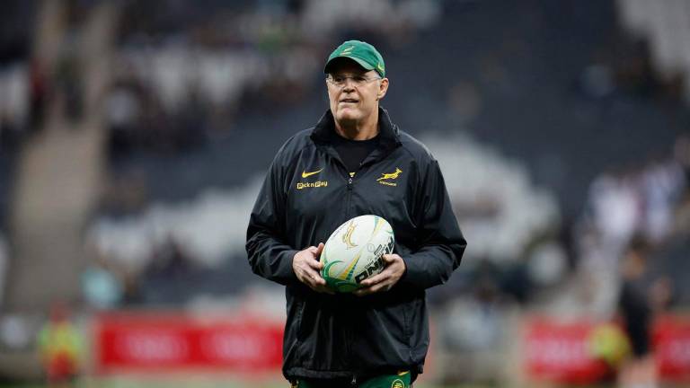 South African head coach Rassie Erasmus walks in the pitch ahead of the warm up session during the international rugby union Test match between South Africa and Georgia at Mbombela Stadium in Mbombela on July 19, 2025. - PHILL MAGAKOE / AFP