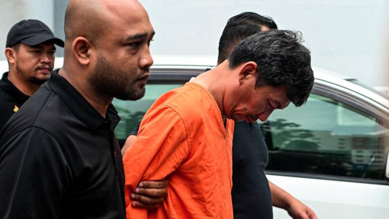 A 46-year-old father pleaded not guilty at the Sessions Court here today to a charge of causing the death of his two children at the estuary of Sungai Linggi, Tanjung Agas, Port Dickson, on Sept 4. - BERNAMAPIX