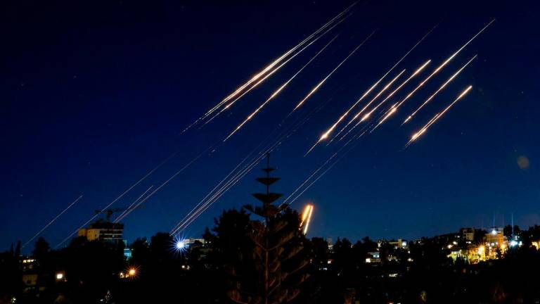 Missiles fired from Iran are pictured in the night sky over Jerusalem on June 14, 2025. Israel and Iran exchanged fire on June 14, a day after Israel unleashed an unprecedented aerial bombing campaign that Iran said hit its nuclear facilities, “martyred” top commanders and killed dozens of civilians. AFP