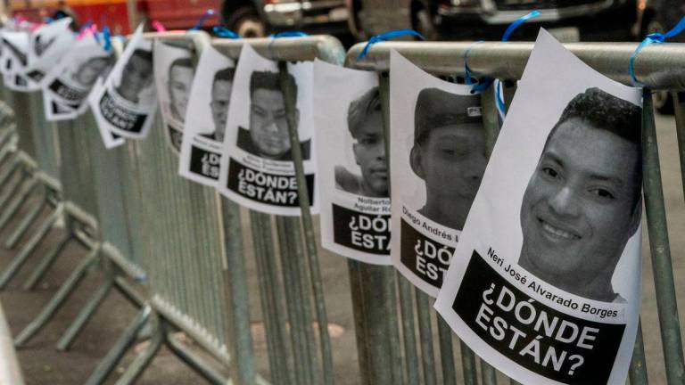 Images of people detained by the U.S. Immigration and Customs Enforcement (ICE) are tied to barricades outside a U.S. immigration court in Manhattan, in New York City, U.S., July 10, 2025.