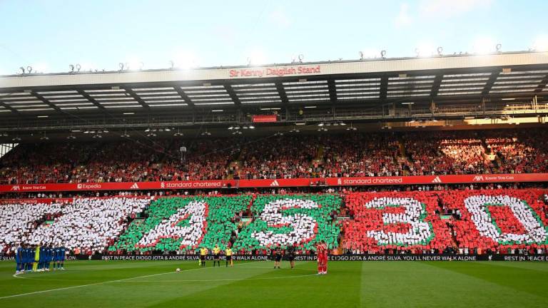 Players observe a moment of silence to pay tribute to Liverpool’s late Portuguese forward Diogo Jota and his brother Andre Silva, who passed away in a car crash ahead of the English Premier League football match between Liverpool and Bournemouth at Anfield in Liverpool, north west England on August 15. AFPPix