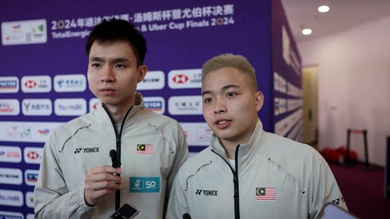 Team captain and men’s doubles player, Soh Wooi Yik (left). - BERNAMAPIX