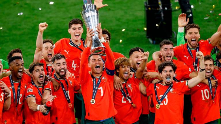 Portugal’s forward #07 Cristiano Ronaldo (C) lifts the trophy after winning the UEFA Nations League final football match between Portugal and Spain in Munich, southern Germany on June 8, 2025. AFPpix