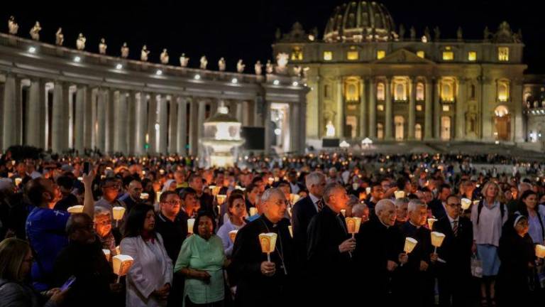 Faithful and cardinals attend a torchlight procession, ahead of the Conclave and the election of the new pope, which will start on May 7, at St. Peter’s square at the Vatican, May 3, 2025. REUTERSpix
