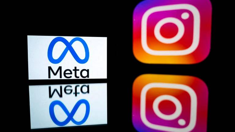 Logos of Instagram app and its parent company Meta. - Lionel BONAVENTURE / AFP