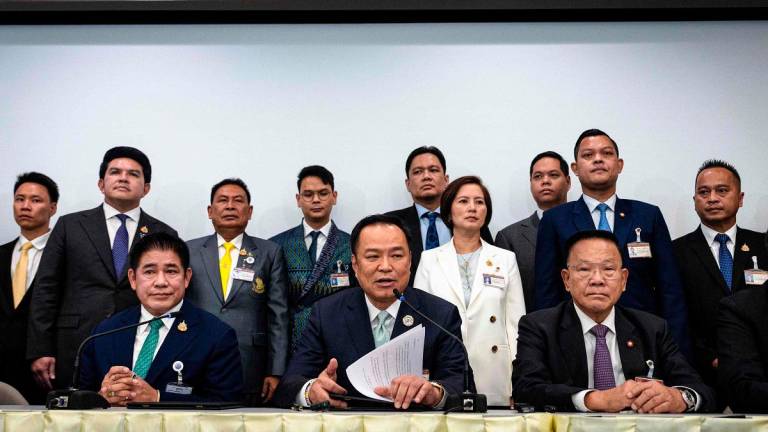 Bhumjaithai Party leader Anutin Charnvirakul (C) attends a press conference after securing the backing of opposition People’s Party to serve as Thailand’s next prime minister at the parliament in Bangkok on September 3, 2025. - Chanakarn Laosarakham / AFP