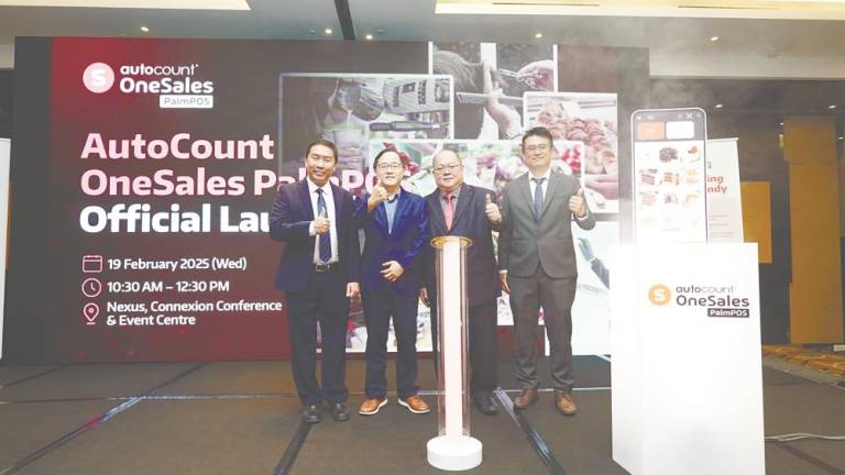 From left: AutoCount Dotcom senior channel sales manager Christopher Liew, executive director Choo Chin Peng, YT Choo, and sales and marketing director Alex Ng at the launch of AutoCount OneSales PalmPOS.