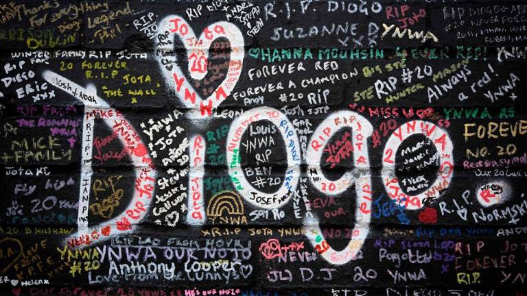The mural, dedicated to the Portugese footballer who died in a car crash last month, has been created by artist Murwalls and is located adjacent to Anfield stadium in Liverpool, north west England. Paul ELLIS / AFPPix