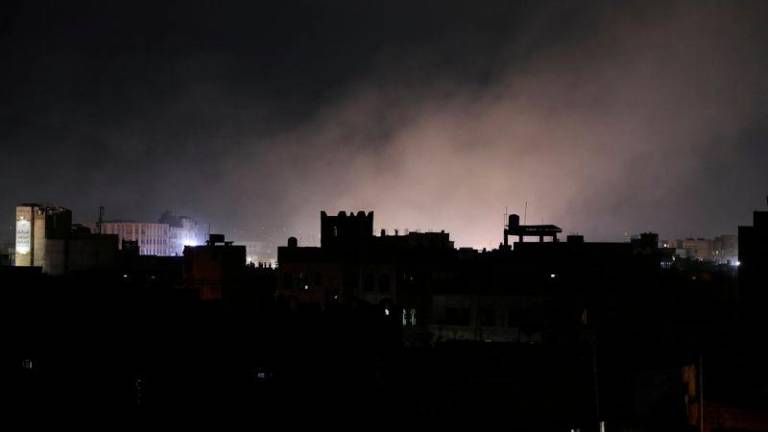 Dust rises from the site of strikes in Sanaa, Yemen March 15, 2025. - REUTERSPIX