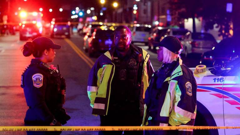 Police officers work at the site where, according to the U.S. Homeland Security Secretary, two Israeli embassy staff were shot dead near the Capital Jewish Museum in Washington, D.C., U.S. May 21, 2025. REUTERSpix
