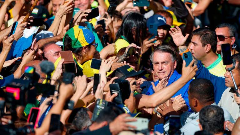 Brazil’s former President Jair Bolsonaro (R) poses for a picture with supporters during a rally on Paulista Avenue in Sao Paulo, Brazil, on June 29, 2025. - AFPpix