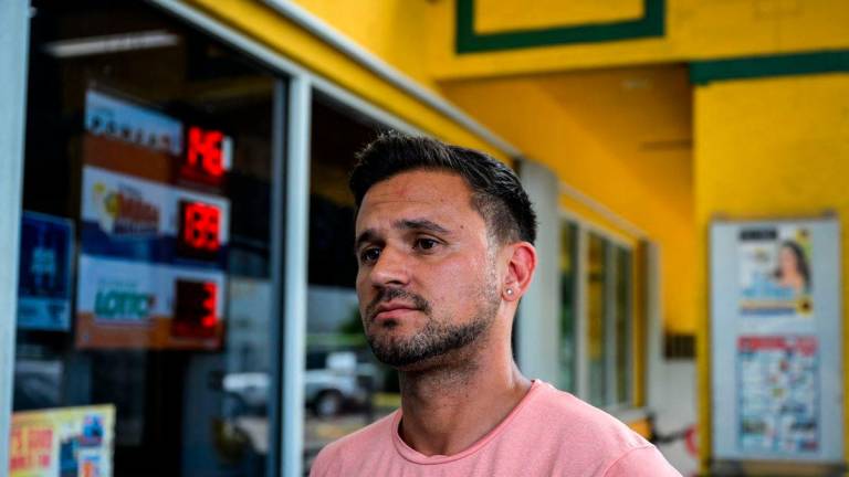 Denis Caldeira looks on as he speaks during an AFP interview outside a Venzuelan food mart in Doral, Florida, May 20, 2025.