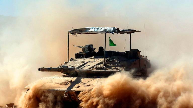 Israeli troops deploy by Israel’s border fence with the Gaza Strip on July 10, 2025, amid the ongoing war with the Palestinian militant movement Hamas. Photo by Jack GUEZ / AFP