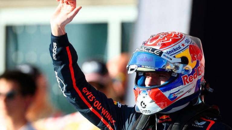 Pole position qualifier Max Verstappen of the Netherlands and Oracle Red Bull Racing waves in parc ferme during Qualifying ahead of the F1 Grand Prix of United States at Circuit of The Americas on October 18, 2025 in Austin, Texas. - Mark Thompson/Getty Images/AFP