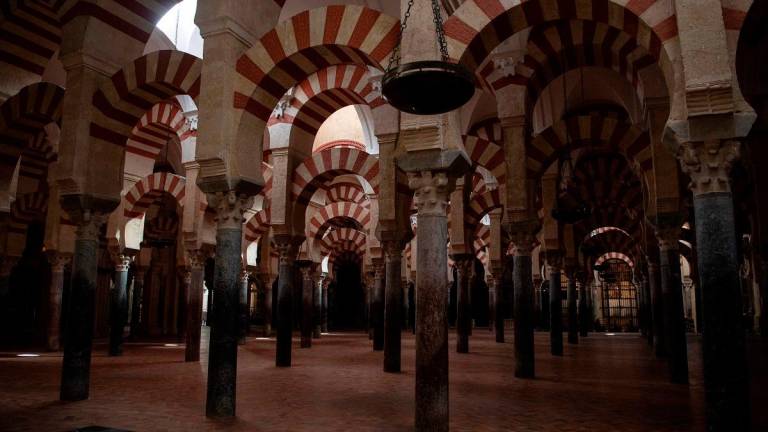 This photograph shows the horseshoe arches on columns of the historic mosque-cathedral of Cordoba in an area affected by a fire that broke out the previous day in the monument, in Cordoba southern Spain on August 9, 2025. A fire broke out in the historic mosque-cathedral on August 8, but it was quickly contained, firefighters said. - JORGE GUERRERO / AFP