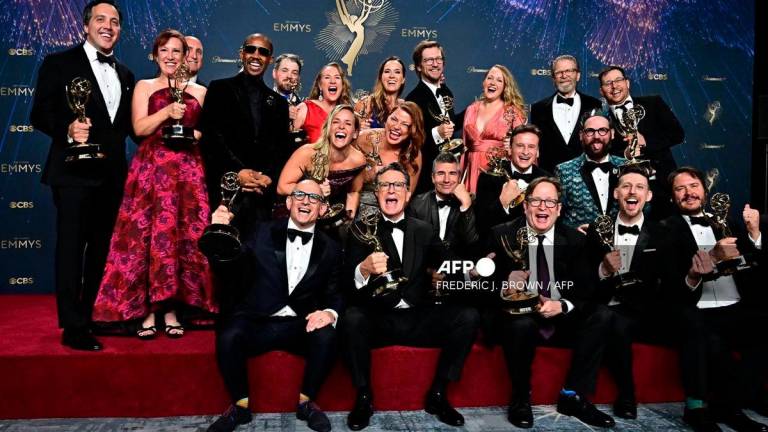 US comedian writer Stephen Colbert (C) poses in the press room with the award for Outstanding Talk Series award for “The Late Show with Stephen Colbert” during the 77th Primetime Emmy Awards at the Peacock Theatre at LA Live in Los Angeles on September 14, 2025. (Photo by Frederic J. Brown / AFP)