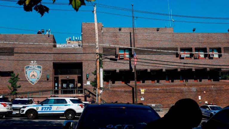 The U.S. flag hangs at half mast outside the 47th precinct, which was the police station for the New York Police Department’s Didarul Islam who was killed in the deadly mass shooting, outside the precinct in the Bronx borough of New York City - Reuterspix