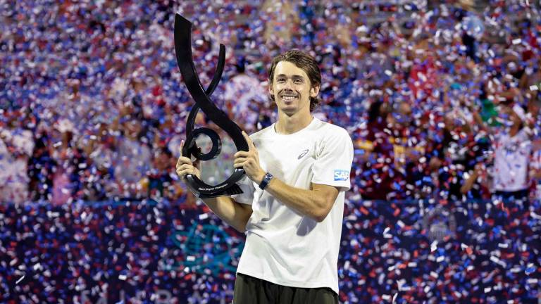 Alex De Minaur of Australia poses with the men’s singles championship trophy after winning the men’s singles finals match against Alejandro Davidovich Fokina of Spain on the final day of the Mubadala Citi DC Open 2025 at William H.G. FitzGerald Tennis Center on July 27, 2025 in Washington, DC. Photo by Scott Taetsch / GETTY IMAGES NORTH AMERICA / AFP