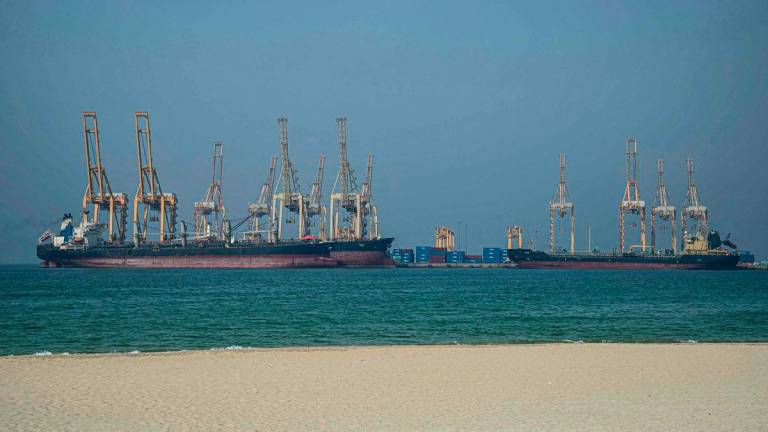 Tankers are seen at the Khor Fakkan Container Terminal along the Strait of Hormuz, a waterway through which one-fifth of global oil output passes on June 23, 2025. (Photo by Giuseppe CACACE / AFP)