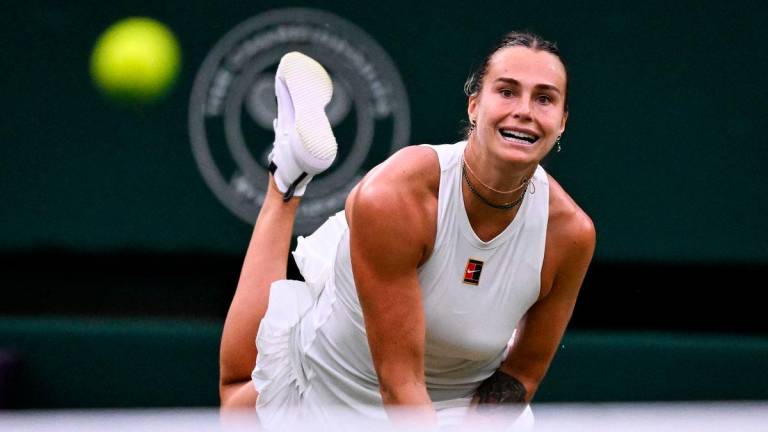 Belarus’s Aryna Sabalenka eyes the ball as she returns it to Belgium’s Elise Mertens during their women’s singles fourth round tennis match on the seventh day of the 2025 Wimbledon Championships at The All England Lawn Tennis and Croquet Club in Wimbledon, southwest London, on July 6, 2025- AFP