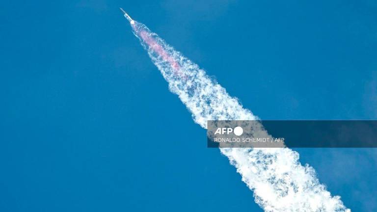 SpaceX’s Starship rocket is seen after lifting off from Starbase, Texas, as seen from South Padre Island on August 26, 2025, for its tenth test flight. SpaceX’s Starship megarocket roared into the skies Tuesday on its 10th test flight, following a string of explosive failures that cast doubt about its ability to realize Elon Musk’s vision of colonizing Mars. - RONALDO SCHEMIDT / AFP