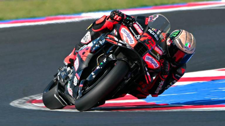 Aprilia Racing team's Italian MotoGP rider Marco Bezzecchi during the second practice session ahead of the San Marino Moto GP Grand Prix at the Misano World Circuit Marco Simoncelli, in Santa Monica-Cella, northern Italy, on September 13, 2025. - AFPPIX
