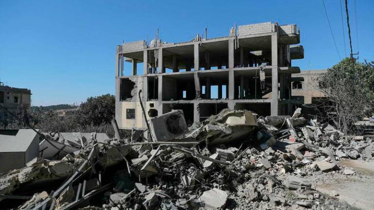 The rubble of a destroyed building is piled up in the aftermath of Israeli airstrikes that targeted Al-Asira in the vicinity of the eastern Lebanese city of Baalbeck - REUTERSpix