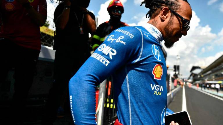 Ferrari’s British driver Lewis Hamilton walks near the track before the first practice session ahead of the Italian Formula One Grand Prix at the Autodromo Nazionale Monza circuit, in Monza. AFPPix