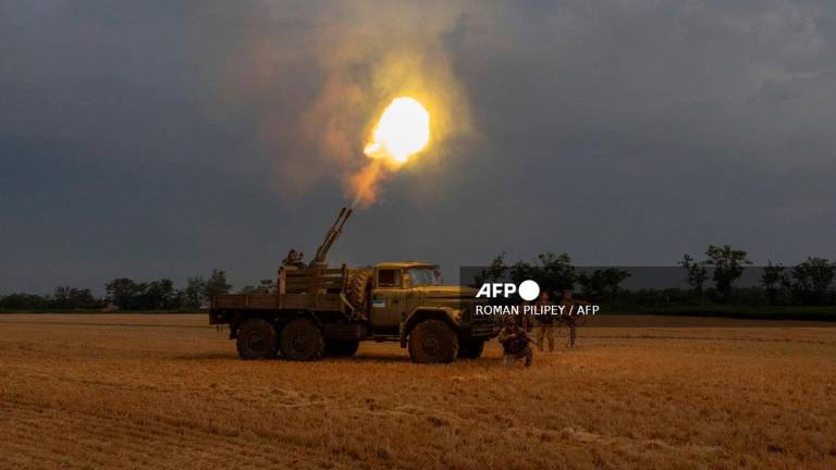 Ukrainian servicemen of the 59th brigade mobile air defence unit fire a Soviet made ZU-23 anti-aircraft twin autocannon towards a Russian drone during an air attack near Pavlograd, Dnipropetrovsk region on July 19, 2025, amid the Russian invasion of Ukraine. - Roman PILIPEY / AFP